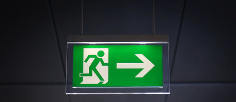 escape route emergency fire exit light hanging from ceiling